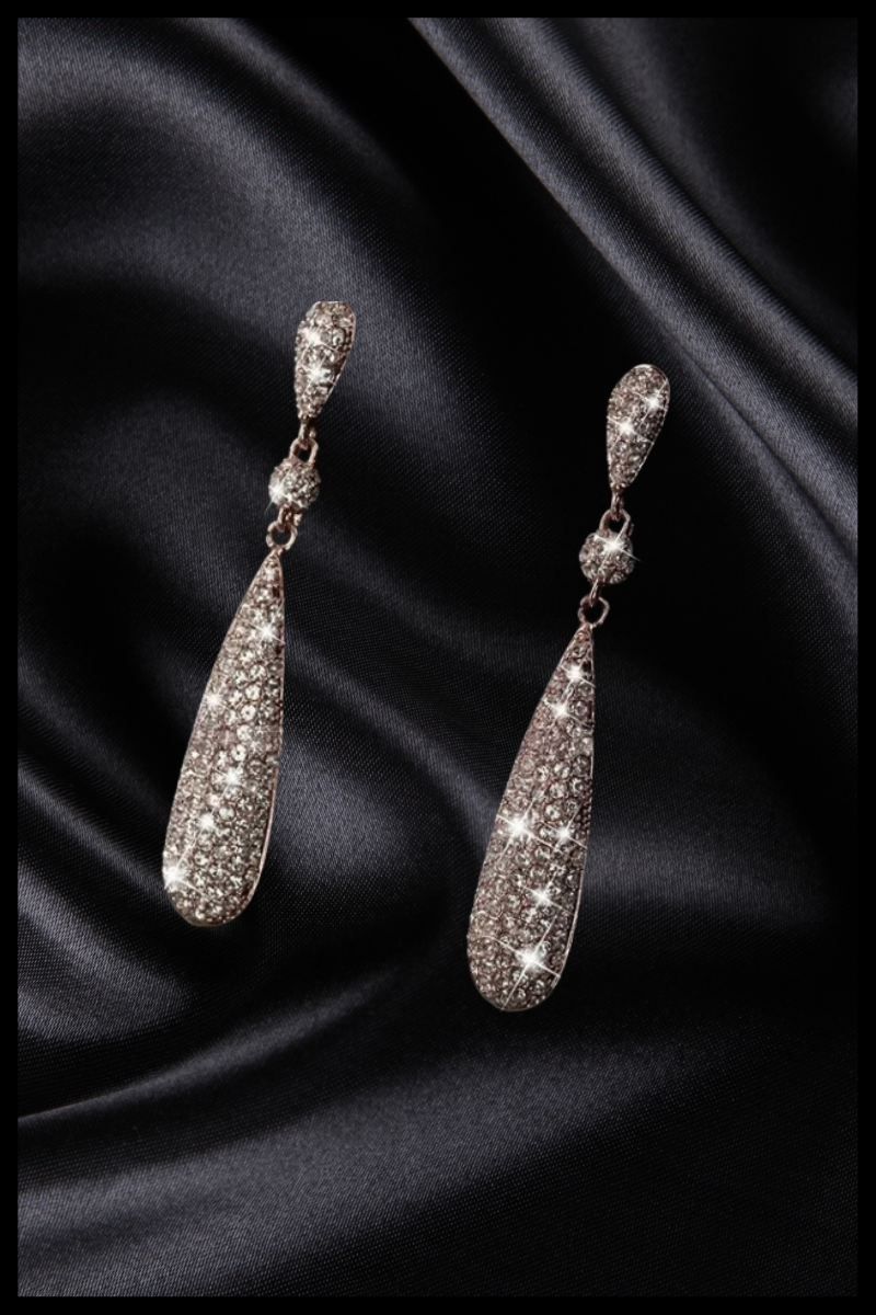 Silver teardrop solid earring with diamonte